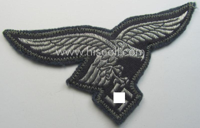 Superb - and simply never used! - WH (LW) officers'- (ie. evt. NCO-) type breasteagle (ie. 'Brustadler') as was executed in neatly woven, silver-coloured thread (ie. 'flatwire-style') onto a greyish-blue-coloured- and/or woolen-based background