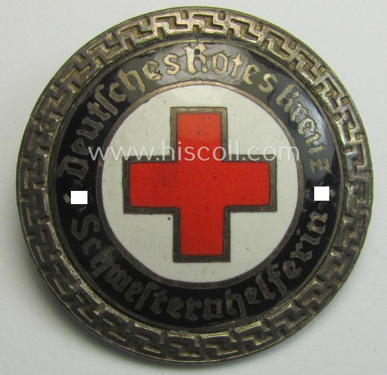 Attractive - and nicely preserved! - DRK (ie. 'Deutsches Rotes Kreuz' or German Red Cross) nurses'-helpers-badge entitled: 'Schwesternhelferin' (being an example that shows a: 'Ges.Gesch.'-patent-pending (and '1'-) marking on its back