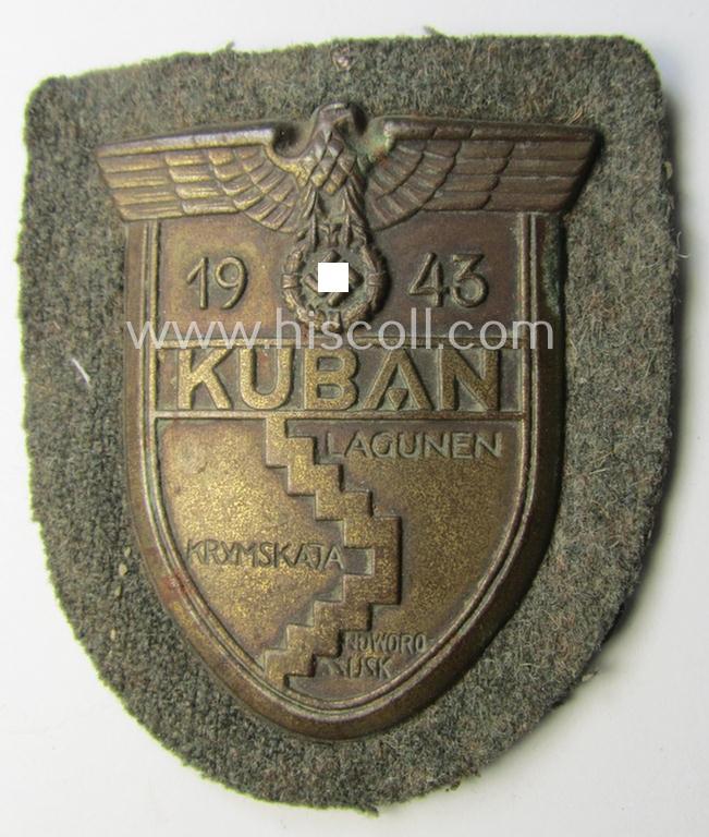 Attractive - truly worn and actually scarcely encountered! - WH (Heeres ie. Waffen-SS) 'Kuban'-campaign-shield that comes mounted onto its original field-grey-coloured- and/or woolen-based 'backing' as issued and/or used