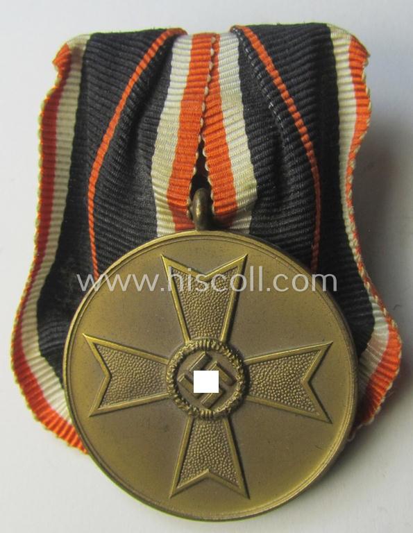 Attractive example of a so-called: 'Einzelspange' (ie. single-pieced medal-bar) showing a: 'Kriegsverdienstmedaille 1939' (or: war-merits-medal), being a neat 'Buntmetall'-based specimen