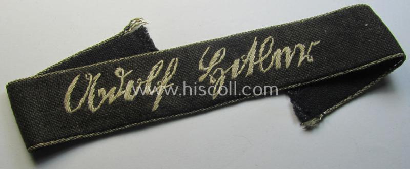 Superb - truly used- and/or worn! - Belgian-produced 'Waffen-SS' cuff-title (ie. 'Ärmelstreifen') as executed in typical 'hand-embroidered'-pattern as was intended for a member serving within the: 1. SS-Pz-Division 