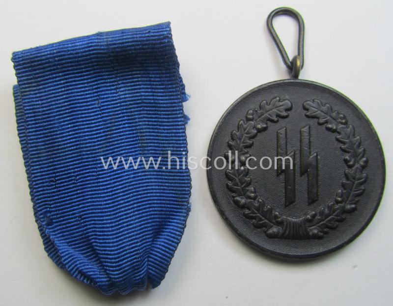 Superb - and actually rarely encountered! - 'SS-Dienstauszeichnung der 4. Stufe' (or black-toned, loyal-service medal for 4 years of loyal-service in the SS) that comes together with its original (and slightly used) ribbon (ie. 'Bandabschnitt')