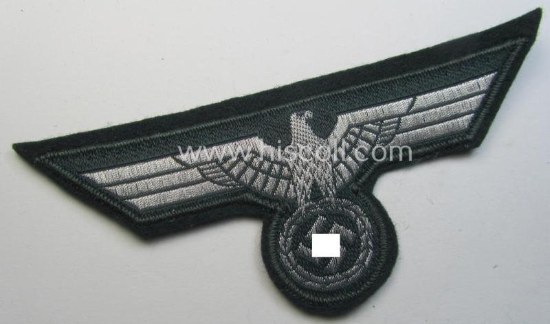 WH (Heeres) breast-eagle as executed in 'BeVo'-type-, so-called: 'flat-wire'-weave-pattern and pre-mounted on darker-green-coloured wool as was specifically intended for usage by soldiers (ie. NCOs) on their dress-tunics (ie. 'Waffenröcke')