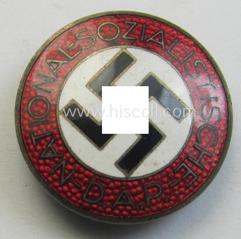 Neatly enamelled- (and bright-red-coloured!) 'N.S.D.A.P.'-membership-pin- ie. party-badge (or: 'Parteiabzeichen') which is nicely maker-marked on the back with the makers'-designation: 'RzM' and/or: 'M1/34'