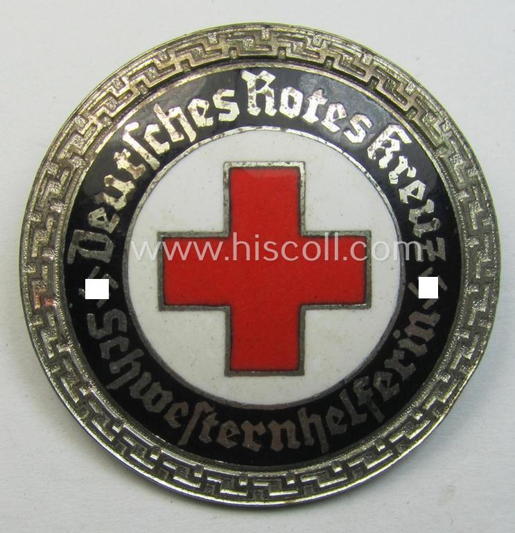 Attractive - and nicely preserved! - DRK (ie. 'Deutsches Rotes Kreuz' or German Red Cross) nurses'-helpers-badge entitled: 'Schwesternhelferin' (being an example that shows a: 'Ges.Gesch.'-patent-pending-designation on its back