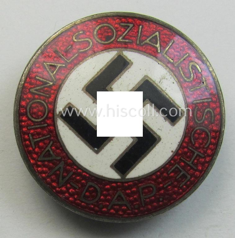 Neatly enamelled- (and bright-red-coloured!) 'N.S.D.A.P.'-membership-pin- ie. party-badge (or: 'Parteiabzeichen') which is nicely maker-marked on the back with the makers'-designation: 'RzM' and/or: 'M1/34'