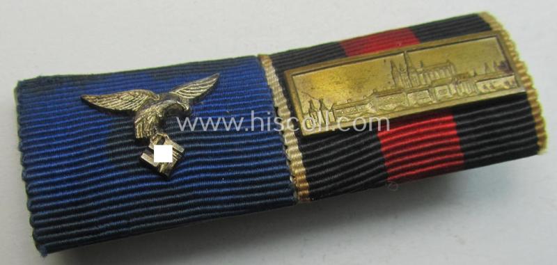 Superb, two-pieced WH (Luftwaffe) ribbon-bar (ie. 'Band- o. Feldspange') that is showing the ribbons for a: WH (LW) 'DA 4. St.' and a Czech 'Anschluss'-medal (and having a detailed miniature 'Prager Burg-Spange' period-attached)