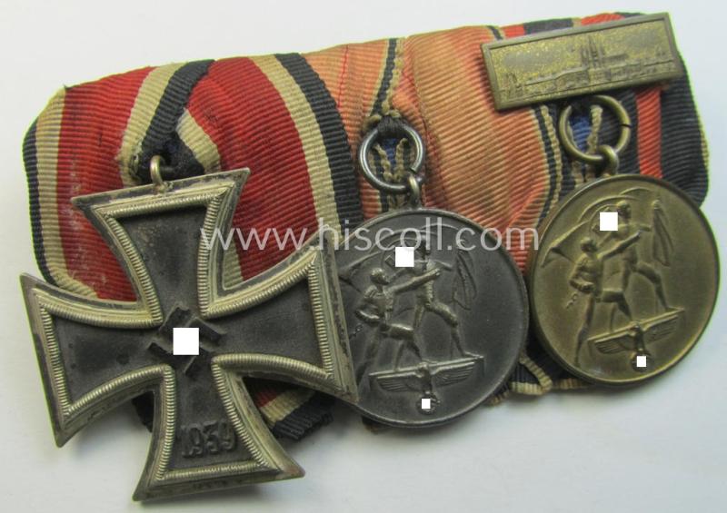 Neat example of a 3-pieced WH (Heeres o. Kriegsmarine etc.) medal-bar (ie.: 'Ordenspange') resp. showing an: 'EKII.Kl.' and a Austrian- and Czech 'Anschluss'-medal (that comes with a firmly attached 'Prager Burg-Spange')