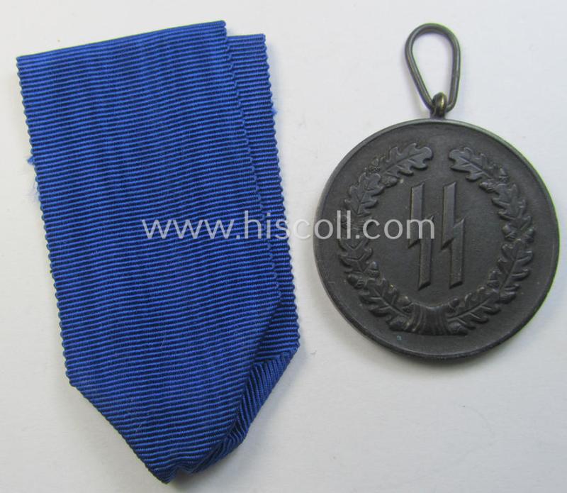 Superb - and actually rarely encountered! - 'SS-Dienstauszeichnung der 4. Stufe' (or black-toned, loyal-service medal for 4 years of loyal-service in the SS) that comes together with its original (and slightly used) ribbon (ie. 'Bandabschnitt')