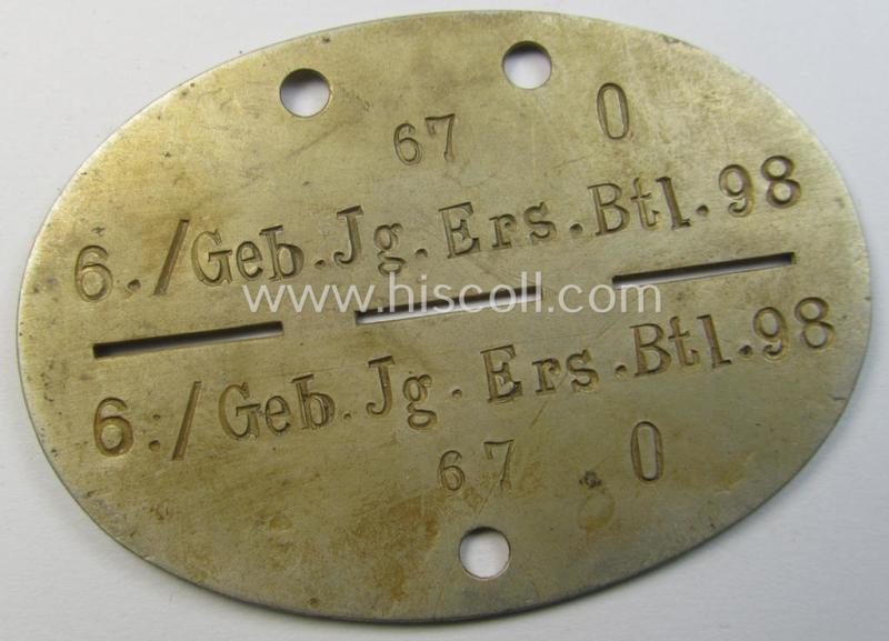 Superb - and truly scarcely found! - typical aluminium-based, WH (Heeres-) ie. 'Gebirgsjäger'-related ID-disc (ie. 'Erkennungsmarke') bearing the clearly stamped unit-designation that reads: '6./Geb.Jg.Ers.Btl. 98' and that comes as issued and found