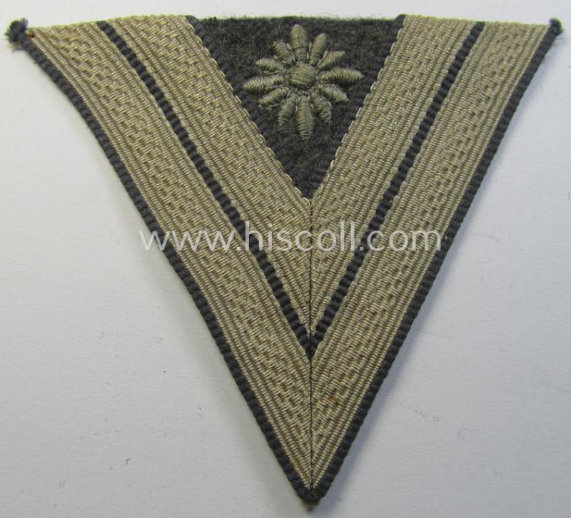 Attractive, WH (Luftwaffe) 'Armwinkel' (or: arm-chevron) as executed on typical bluish-grey-coloured wool as was specifically intended for usage by a soldier with the (unusually encountered!) rank of: 'Stabsgefreiter'