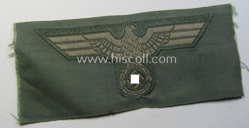 Early- (ie. mid-) war-period, WH (Heeres) cap-eagle (ie. 'Schiffchenmützen-Adler für Mannschaften u. Uffz.') being a 'virtually mint' example as executed in bluish-grey-coloured linnen on a field-grey-coloured background