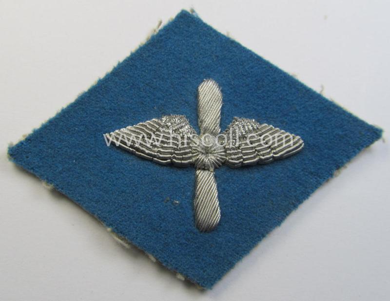 Attractive - and truly very scarely found! - early-period- and neatly hand-embroidered so-called: 'Flieger-HJ' (ie. 'Hitlerjugend') arm-badge being a 'virtually mint- ie. unissued' example that still retains it period-attached 'RzM'-etiket