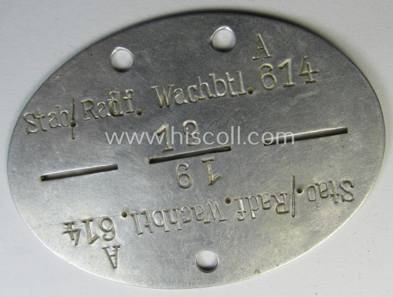 Superb - and scarcely found! - typical aluminium-based, WH (Heeres-) ie. 'Radfahr'-related ID-disc (ie. 'Erkennungsmarke') bearing the clearly stamped unit-designation that reads: 'Stab./Radf.Wachbtl. 614' and that comes as issued and worn