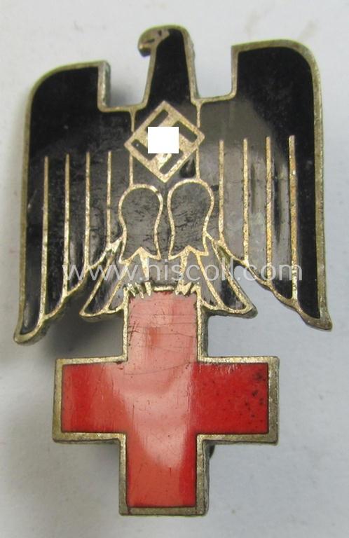 Early-pattern, multi-coloured- and/or neatly enamelled DRK (ie. 'Deutsches Rotes Kreuz') civil-attire badge (or: 'Zivilabzeichen des D.R.K.'), being a non-maker-marked example that bears a: 'Ges.Gesch.'-patent-pending marking