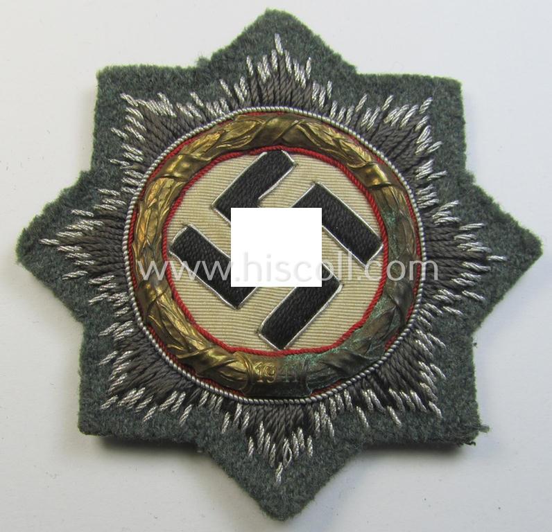 Superb - clearly issued and I deem just minimally worn! - example of a cloth version of a WH (Heeres o. Waffen-SS) 'Deutsches Kreuz im Gold' (ie. DKiG or German Cross in gold) that comes in an overall very nice- (ie. fully untouched!), condition