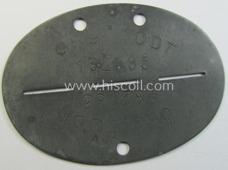 Neat - and unusually found! - typical zinc-based, 'Organisation Todt'-related ID-disc (ie. 'Erkennungsmarke') bearing the clearly stamped designation that reads: 'Org. Todt - 182735'