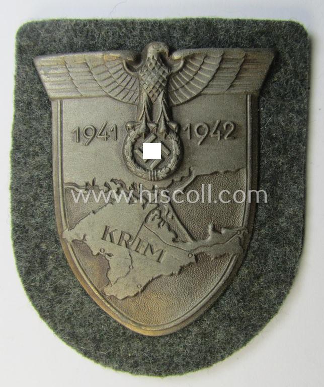 Attractive - and I deem issued but simply never used! - WH (Heeres ie. Waffen-SS) 'Krim'-campaign-shield (as was produced by a by me unidentified maker) and that comes in a wonderful and/or fully untouched, condition