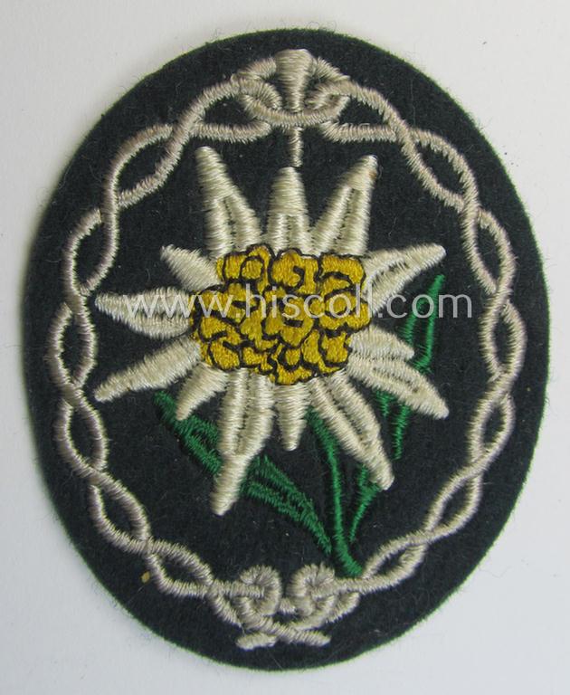 Attractive - and 'virtually mint'! - WH (Heeres) EM- (ie. NCO-) type 'Edelweiss'-armpatch being a machine-embroidered example as was executed on darker-green wool as was intended for usage by the: 'Gebirgsjäger-Truppen' throughout the war