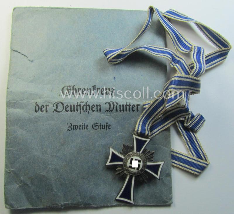 Medal-set: 'Ehrenkreuz der deutschen Mutter - zweite Stufe' (or: silver-class mothers'-cross) that came mounted onto its long-sized (ie. full-length!) ribbon and that came stored in its period pouch (by the maker: 'E.Ferd. Wiedmann')