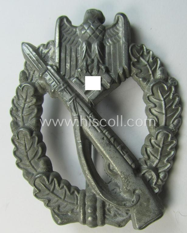 Attractive, 'Infanterie Sturmabzeichen in Silber', being an unmarked (and minimally converse- ie. vaulted-) 'hollow-back' example as was executed in silver-coloured, zinc-based metal (ie. 'Feinzink') as produced by the maker: 'Schauerte & Höhfeld'