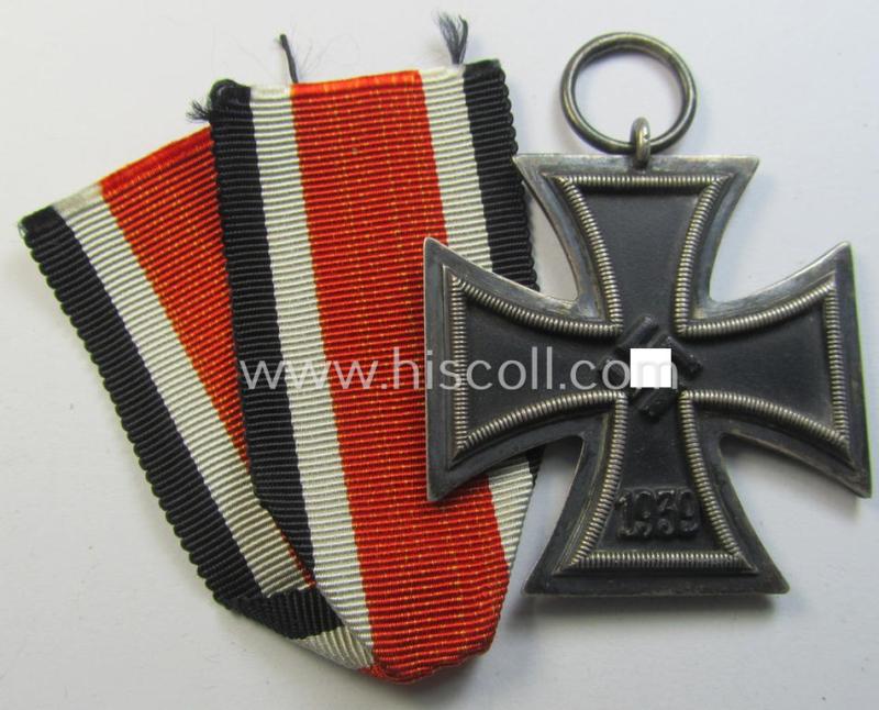 Neat, 'Eisernes Kreuz II. Klasse' being a non-maker-marked example as was produced by the maker (ie. 'Hersteller'): 'E. Ferd. Wiedmann' and that comes together with its original - albeit shortened - ribbon (ie. 'Bandabschnitt')