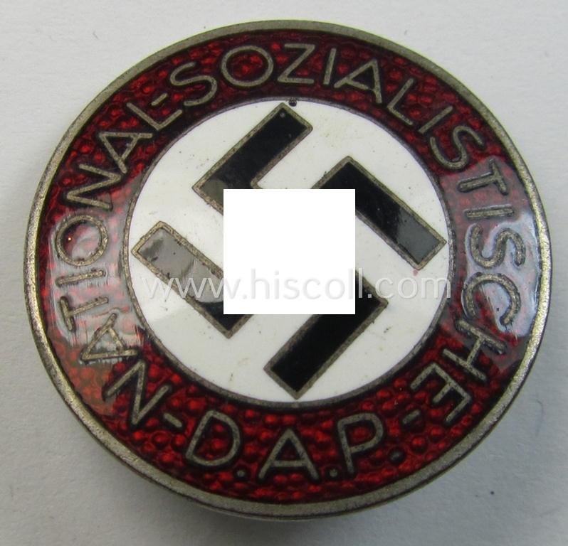 Attractive - darker-red-coloured and nicely preserved! - 'N.S.D.A.P.'-membership-pin- ie. party-badge (or: 'Parteiabzeichen') which is maker-marked on its back with the makers'-designation: 'RzM' and/or: 'M1/103'