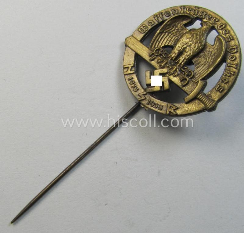 Superb - and rarely found! - Austrian-related, golden-bronze-toned: 'Nationalsozialistischer Soldatenring'- (ie. NSR-) lapel-pin (ie. 'Mitgliedsabzeichen') depicting an eagle-device and text: 'Waffenträger des Volkes 1933-1938'