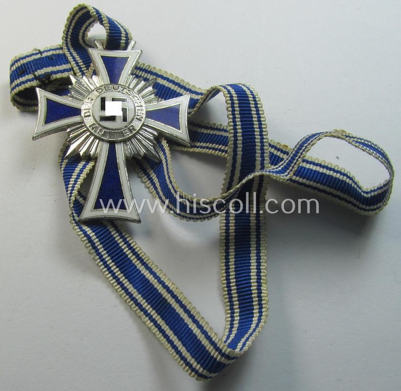 Superb, 'Ehrenkreuz der deutschen Mutter - zweite Stufe' being a non-maker-marked example that comes mounted onto its (large-sized!) ribbon and that comes in an overall very nice- (albeit minimally worn- ie. used-), condition