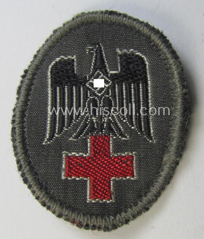 Neat - and actually scarcely encountered! - example of a German Red Cross ('DRK' or: 'Deutsches Rotes Kreuz') side-cap eagle (of the desirable first pattern!) to be worn on the specic, greyish-blue-coloured DRK side-caps (ie. 'Schiffchen')