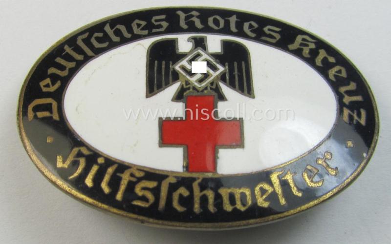 Superb - and rarely seen! - DRK (ie. 'Deutsches Rotes Kreuz') so-called: nurses'-badge entitled: 'Hilfsschwester' being an oval-shaped- and/or maker-marked specimen showing an engraved bearers'-number: ('C-73') and towns'-name: 'Karlsruhe'