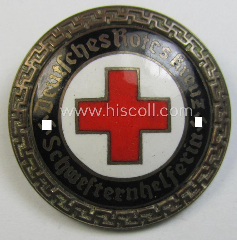 Attractive - and nicely preserved! - DRK (ie. 'Deutsches Rotes Kreuz' or German Red Cross) nurses'-helpers-badge entitled: 'Schwesternhelferin' (being an example that shows a: 'Ges.Gesch.'-patent-pending-marking on its back