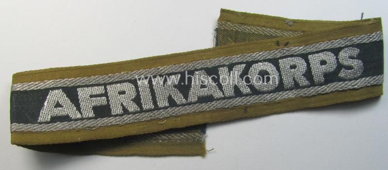 Attractive, 'BeVo'-like cuff-title (ie. 'Ärmelstreifen') entitled: 'Afrikakorps' being a with certainty issued and truly worn example that comes in an overall nice- (ie. shortened- and/or once tunic-attached-), condition