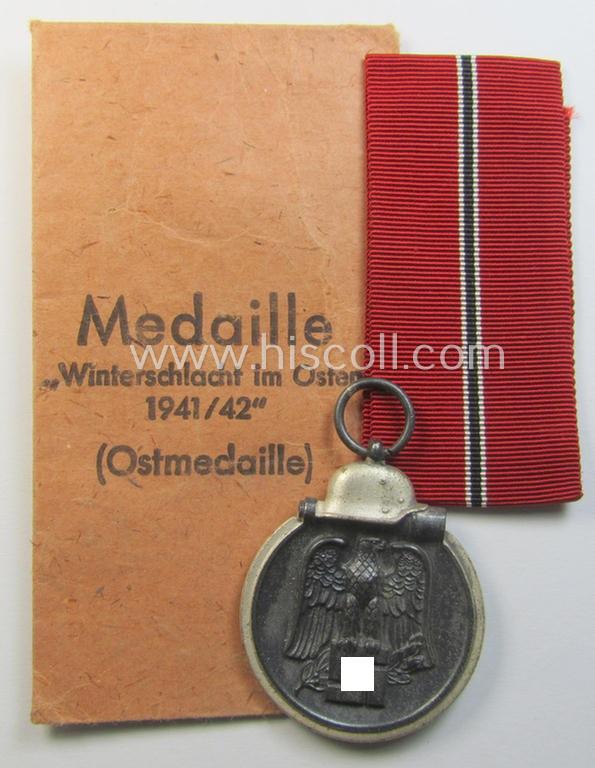 Attractive medal-set: 'Winterschlacht im Osten 1941/42' as produced by the: 'Wilhelm Deumer'-company (being a non-maker-marked specimen that came stored in its original 'Zellstoff'-based pouch of issue as found)