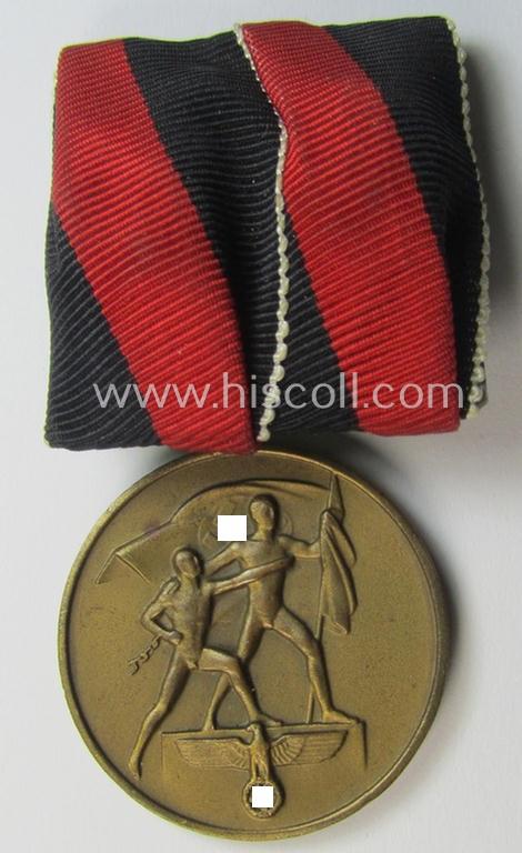 Neat, bright golden-toned WH (Heeres o. KM etc.) so-called: 'Einzelspange' (being of the 'standard-issued'- ie. desirable 'detachable'-pattern) showing a WH Czech 'Anschluss'- (ie. occupation-) medal: '1 October 1938'