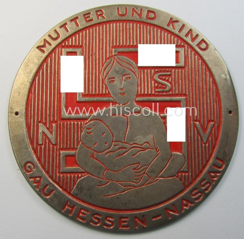 Attractive - and very detailed! - neatly bright-red- (ie. silverish-golden-) coloured (and I deem 'tin-metal'-based-) so-called: 'door-plaque' entitled: 'Mitglied der N.S.-Volkswohlfahrt' (N.S.V.) - Mutter und Kind - Gau Hessen-Nassau'