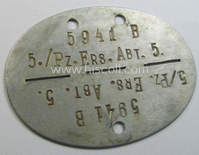 Superb - and scarcely found! - typical aluminium-based, WH (Heeres-) ie. 'Panzer'-related ID-disc (ie. 'Erkennungsmarke') bearing the clearly stamped unit-designation that reads: '5./Pz.Ers.Abt. 5' and that comes as issued