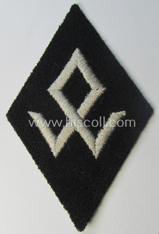 Superb - and rarely found! - SS-pattern, machine-embroidered and black-coloured sleeve-insignia (ie. 'Ärmelraute') depicting an: 'Odal'-rune-sign as was specifically used to signify assignment to the: 'Rasse- u. Siedlungswesen' within the: 'SS'
