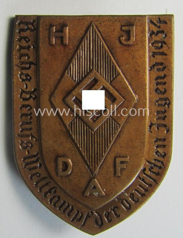Neat - and scarcely encountered! - HJ ie. DAF ('Hitlerjugend'/'Deutsches Arbeitsfront'-) related 'tinnie', being a clearly maker-marked example showing the text: 'Reichs-Berufs-Wettkampf der Deutschen Jugend 1934'