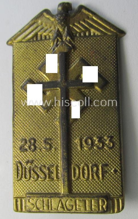 Commemorative, tin-based- and/or: golden-bronze-coloured (I deem) N.S.D.A.P.-related 'tinnie' depicting an eagle-device resting on a cross and swastika-device and that is entitled: '28.5.1933 - Düsseldorf - Schlageter'