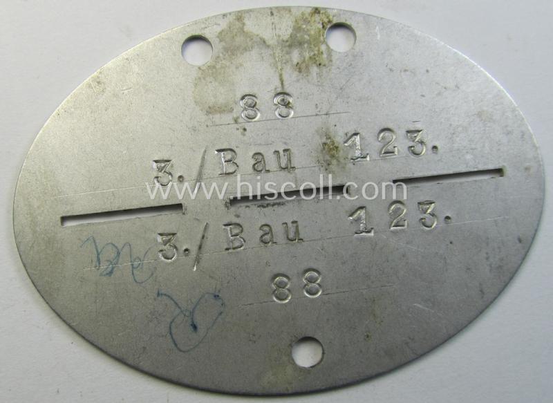 Aluminium-based, WH (Heeres o. Luftwaffe) ie. 'Pioniere- o. Bau-Truppen'-related ID-disc bearing the clearly stamped unit-designation that reads: '3./Bau 123' and that comes as issued and worn