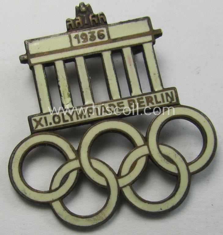 Commemorative - and neatly enamelled! - 'Veranstaltungsabzeichen' being a maker- (ie. 'Paulmann & Crone'-) marked example that is showing the Olympic rings above an illustration of the: 'Reichstag' coupled with text: 'XI. Olympiade Berlin 1936'