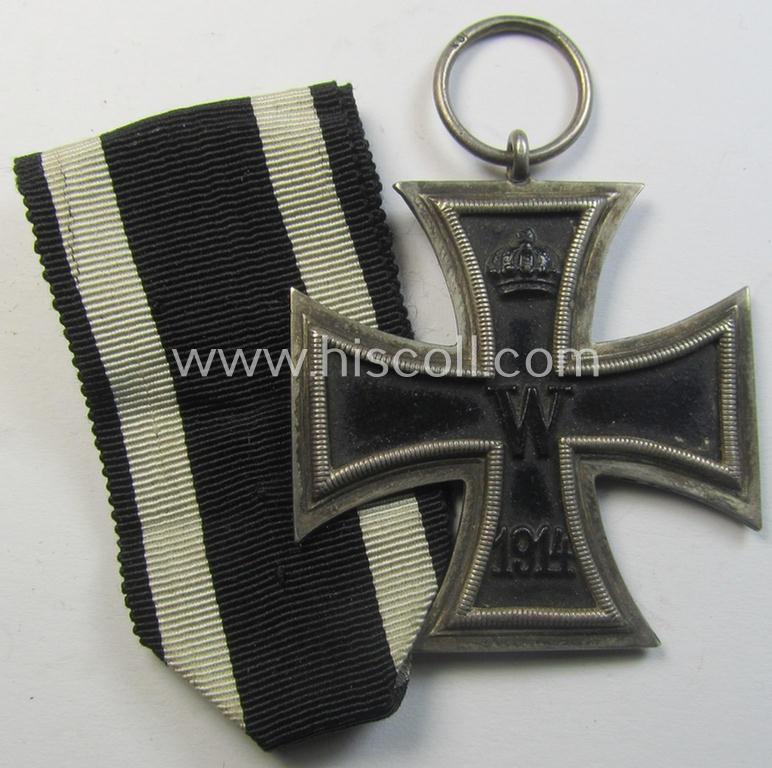 Attractive, WWI-period: 'Eisernes Kreuz II. Klasse' (or: iron cross second class) being a maker- (ie. 'KO'-) marked example that comes together with its (minimally) confectioned piece of ribbon (ie. 'Bandabschnitt')