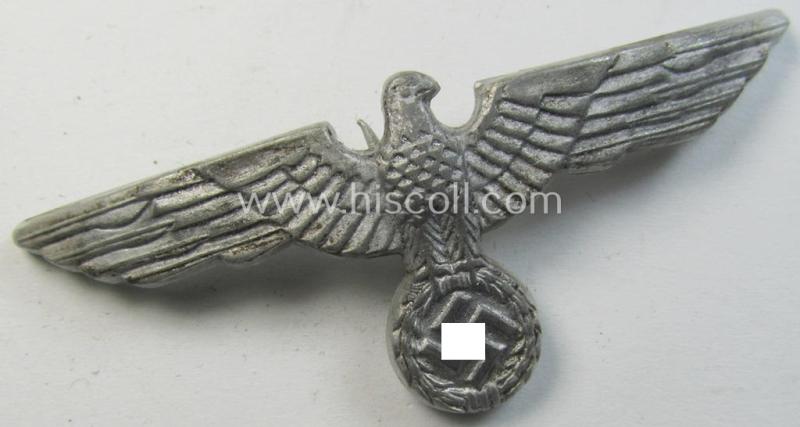 Neat, WH (Heeres) bright-silver-toned (ie. aluminium-based), EM- (ie. NCO- or officers') type visor-cap-eagle being a maker- (ie. 'G.B.'-) marked and/or: '1938'-dated example that comes in a moderately used- ie. once cap-attached-, condition