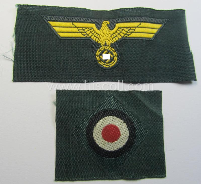 Neat, WH (KM ie. 'Küsten-Marine o. Marine-Artillerie') side-cap-eagle and cocarde-set (being a 'virtually mint- ie. unissued' set as executed in golden-yellow-coloured linnen on a darker-green-coloured background)