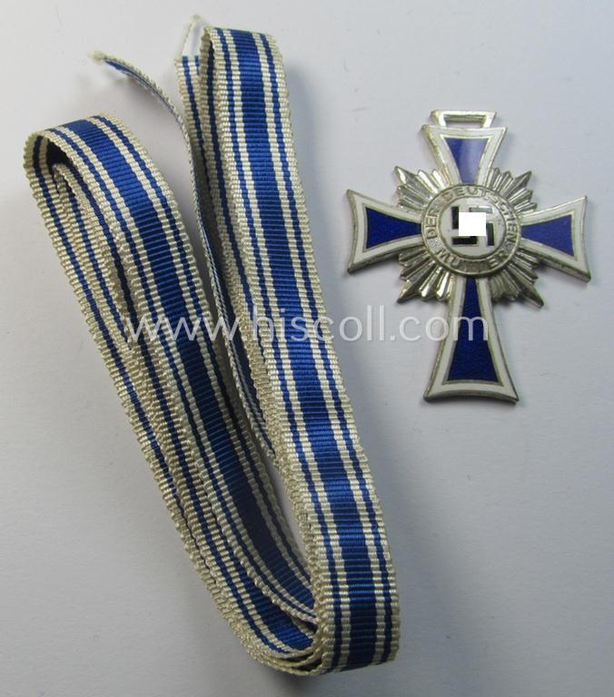 Attractive, 'Ehrenkreuz der deutschen Mutter - zweite Stufe' (or: silver-class mothers'-cross) being a hardly (ie. never!) used example that comes together with its accompanying, long-sized (& minty) ribbon as issued and/or recently found