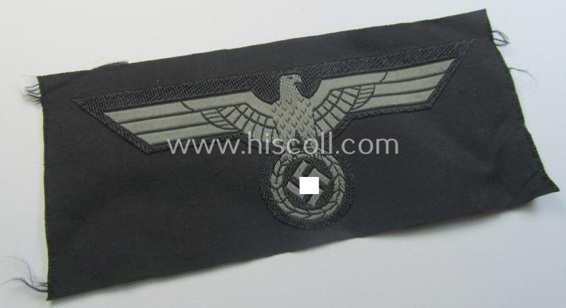 Later- (ie. mid-war-) period, WH (Heeres) 'Panzer'-type breast-eagle (ie. 'Brustadler für Panzertruppen') being a 'virtually mint- ie. unissued' example as executed in bluish-grey-coloured linnen on a black-coloured background