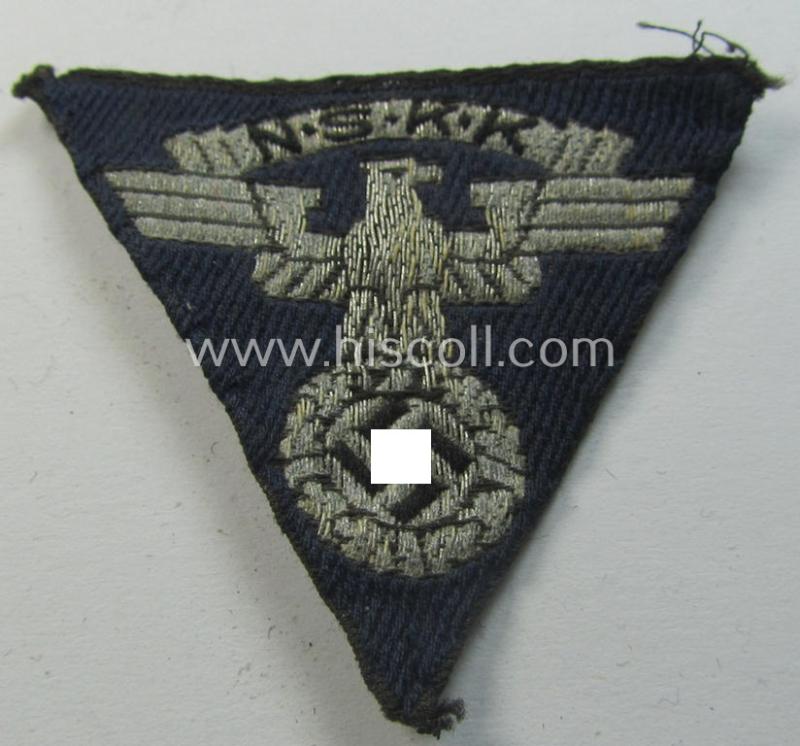 Neat - and clearly used! - so-called: N.S.K.K. (ie. 'National Socialistisches Kraftfahr Korps') side-cap-eagle (ie. 'Adler für N.S.K.K.-Schiffchen o. Lagermütze') being a 'flat-wire-woven'-example onto a darker-blue-coloured background