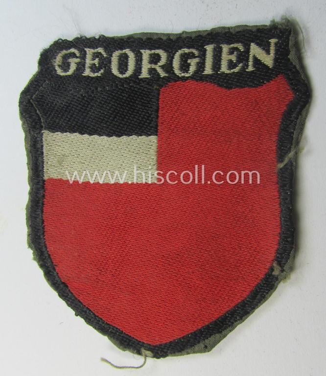 Superb - truly worn and/or carefully tunic-removed! - 'BeVo'-type armshield entitled: 'Georgien' as was specifically intended for usage by a volunteer who served within the 'Deutsche Wehrmacht' ie. within the 'Georgisches Legion'