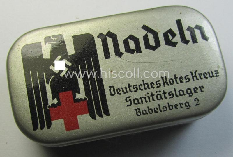 Attractive, smaller-sized 'DRK' (ie. 'Deutsches Rotes Kreuz' or: German Red-Cross) silver-coloured- and/or: tin-based box as was intended for storage of needles ('Nadeln') being a maker- (ie. 'Sanitätslager Babelsberg 2'-) marked example